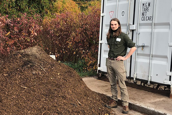 EMBI intern Bryce Oysti with UWGB composter